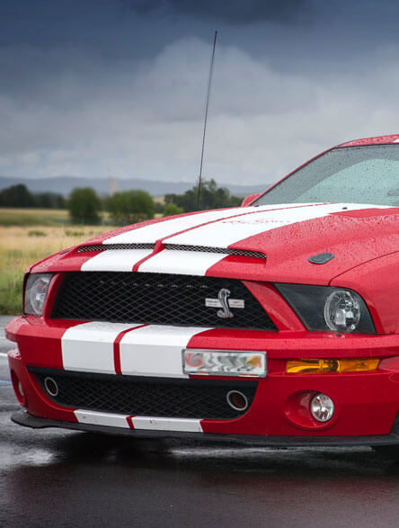 Red Car With Stripe White Lines